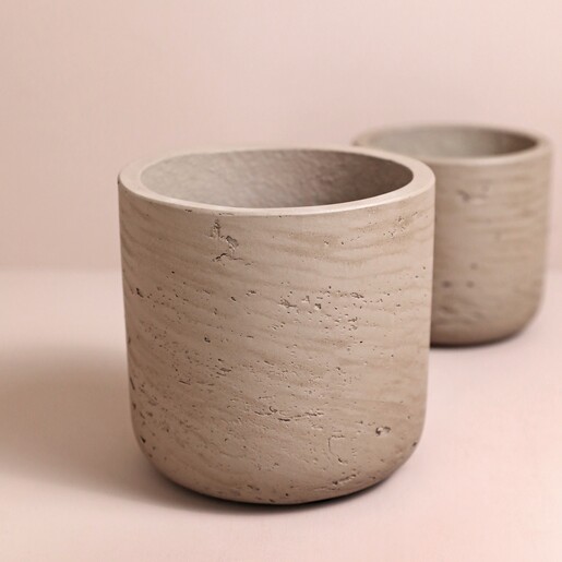 Close up of medium sized pot from Garden Trading Set of 2 Warm Stone Stratton Straight Planter against neutral background