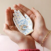 Model Holding Palm Reading Trinket Dish in Between Palms