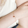 Pearl and Enamel Toadstool Charm Bracelet in Gold on Model with hand on arm