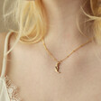 Model Wearing Sleeping Moon Pendant Necklace in Gold