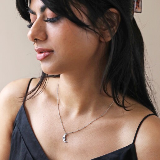 Model Wearing Sleeping Moon Pendant Necklace in Silver