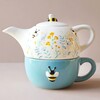 Cornflower Blue Floral Teapot and Mug Set with Beige Background