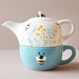 Cornflower Blue Floral Teapot and Mug Set with Beige Background