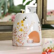 Dusky Pink Floral Ceramic Wax Burner With Candle Inside on Dressing Table
