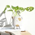 Natural Ceramic Dog Planter in Lifestyle Shot with Plant Inside