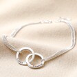 Full Length of Personalised Sterling Silver Interlocking Circles Bracelet on Beige Fabric