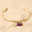 Full Gold Personalised Wide Heart and Birthstone Charm Bracelet on Beige Fabric