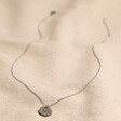 Full Length Men's Personalised Gunmetal Disc Pendant Necklace on Beige Fabric