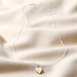 Personalised Sterling Silver Heart Charm Necklace Full Length on Beige Fabric