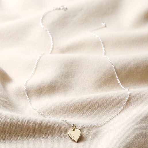 Full Length Personalised Sterling Silver Heart Charm Necklace Full Length on Beige Fabric