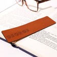 Personalised Name Leather Bookmark Resting on Book