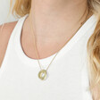 Model wearing gold Personalised Rainbow Pride Eternity Pendant Necklace with white top
