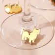 Close Up of Gold Westie from Set of 6 Dog Wine Glass Charms on Base of Wine Glass