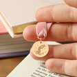 Model Holding Pink Zodiac Charm Ribbon Bookmark