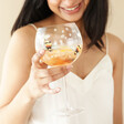 Model Holding Floral Bumblebee Gin Glass