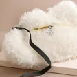 Close up of the Back Jellycat Amuseable Cloud Bag on Beige Background