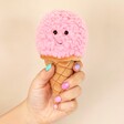 Model Holding Jellycat Irresistible Ice Cream Strawberry Soft Toy against cream background