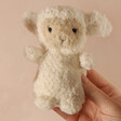Model Holding Jellycat Wee Lamb Soft Toy 