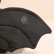 Velcro grip patch on the Jellycat Wrapabat Black Soft Toy