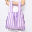 Model holding pastel Kind Bag Lilac Stripes Reusable Shopping Bag