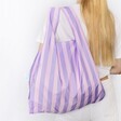 Model wearing Kind Bag Lilac Stripes Reusable Shopping Bag over shoulder