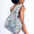 Model using the colourful Kind Bag Meadow Flowers Reusable Shopping Bag