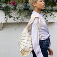 Model using pale yellow Kind Bag Sunbeam Reusable Shopping Bag