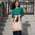Model in green jumper using the cute Kind Bag Yoga Print Reusable Shopping Bag