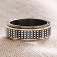 Men's Stainless Steel Black Cross Spinning Band Ring on Neutral Coloured Fabric