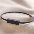 Men's Stainless Steel Thin Wire Bracelet in Black on Beige Coloured Material