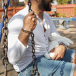 Men's Semi-Precious Stone Bead Bracelet on Model Sat on Swing with Hand on Chain