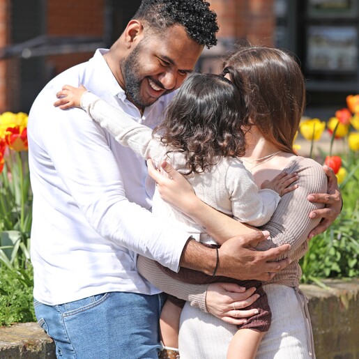 model wearing Men's Thin Woven Leather Bracelet in Black hugging family