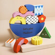 Personalised Shapes Wooden Balance Game out of packaging with shapes stacked on neutral background