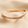 Adjustable 'All Things Lovely' Meaningful Word Wave Bangle in Rose Gold on neutral coloured fabric