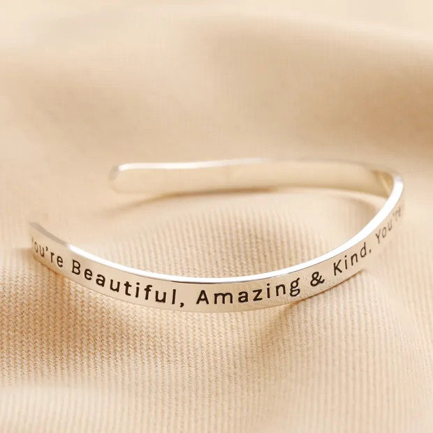 Adjustable 'All Things Lovely' Meaningful Word Wave Bangle in Silver Adjustable 'All Things Lovely' Meaningful Word Wave Bangle in Silver on neutral coloured material