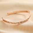 First Side of Adjustable Favourite Person Meaningful Word Wave Bangle in Rose Gold on neutral fabric 