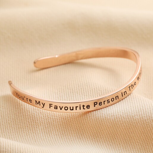 Adjustable Favourite Person Meaningful Word Wave Bangle in Rose Gold First Side of Adjustable Favourite Person Meaningful Word Wave Bangle in Rose Gold on neutral fabric