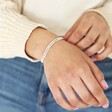 Model Wearing Adjustable 'Mum' Meaningful Word Wave Bangle in Silver