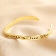 Second Side of Adjustable Nana Meaningful Word Wave Bangle in Gold on Beige Fabric