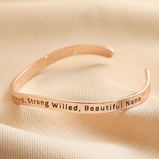 Second Side of Adjustable Nana Meaningful Word Wave Bangle in Rose Gold on beige background