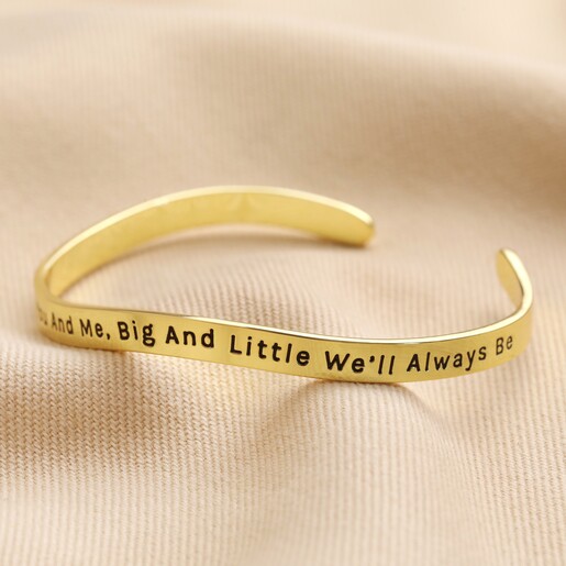 Adjustable 'Sisters' Meaningful Word Wave Bangle in Gold Adjustable 'Sisters' Meaningful Word Wave Bangle in Gold on natural coloured material