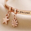 Close Up of Charms on 'Daughter' Meaningful Word Bangle in Rose Gold
