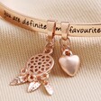 Close Up of Charms on 'Favourite Person' Meaningful Word Bangle in Rose Gold