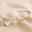 'Never Forgotten' Meaningful Word Bangle in Silver on Neutral Fabric