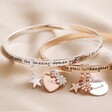 Rose Gold and Silver Personalised 'Daughter' Meaningful Word Bangles on Neutral Fabric