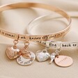 Rose Gold and Silver Personalised 'Friend' Meaningful Word Bangles on Neutral Fabric