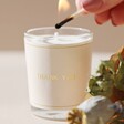Model Lighting Candle in Thank You Candle and Dried Flower Posy Gift