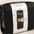 Stackers Black Hanging Travel Washbag With Information on Packaging