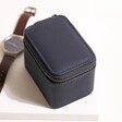 Stackers Navy Blue Zipped Travel Watch Box on Neutral Background with Brown Watch