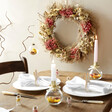 Pink Hydrangea Dried Flower Wreath on Neutral Wall Above Table
